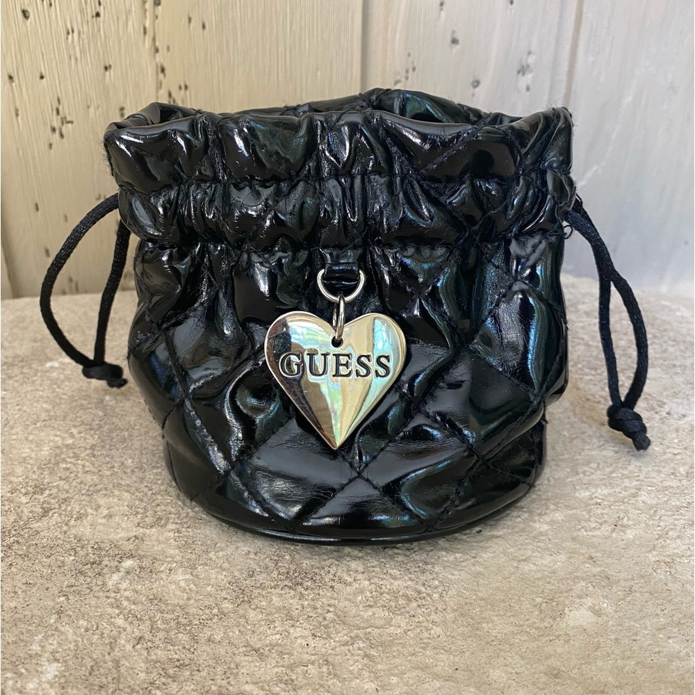 Guess mini drawstring bag.